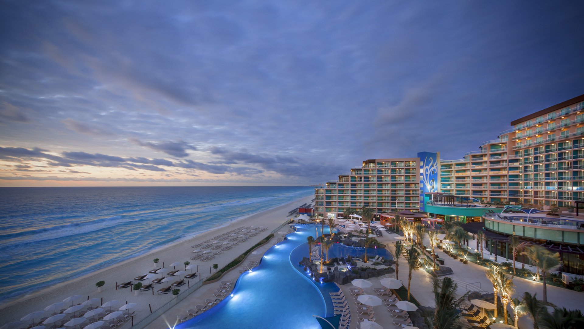 Dusk pool and beach, Cancun Packages, Decoded: Flight + Hotel vs All-Inclusive Bundles