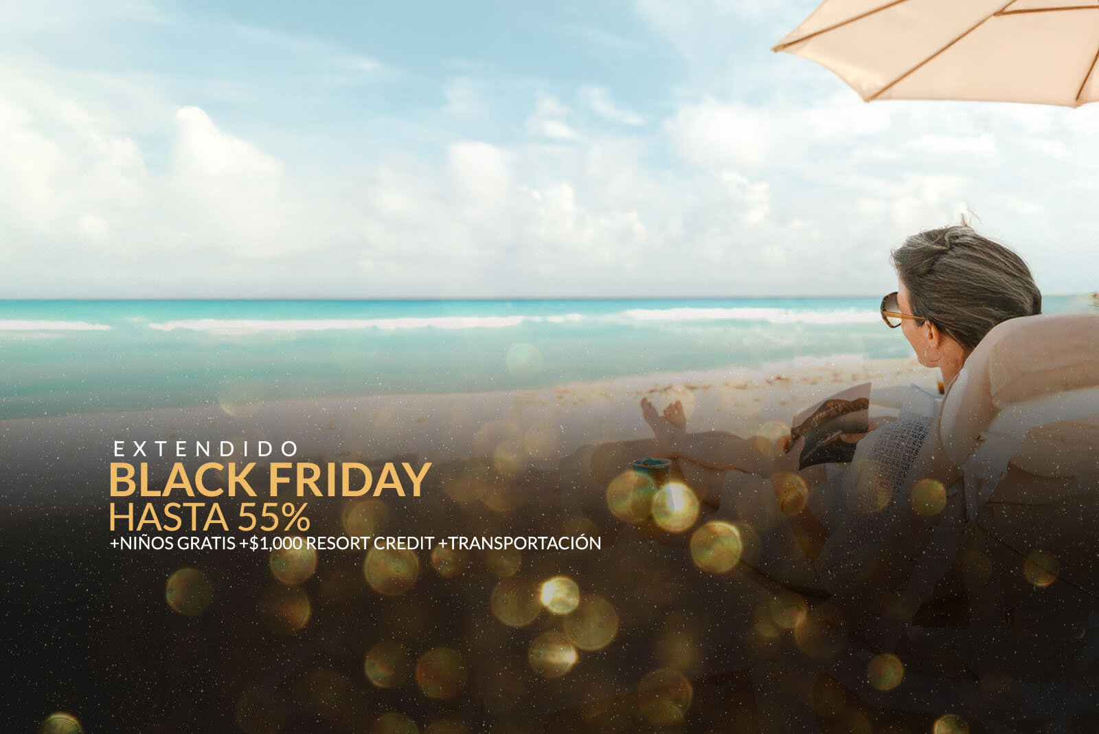 Una mujer sentada bajo una sombrilla en una playa