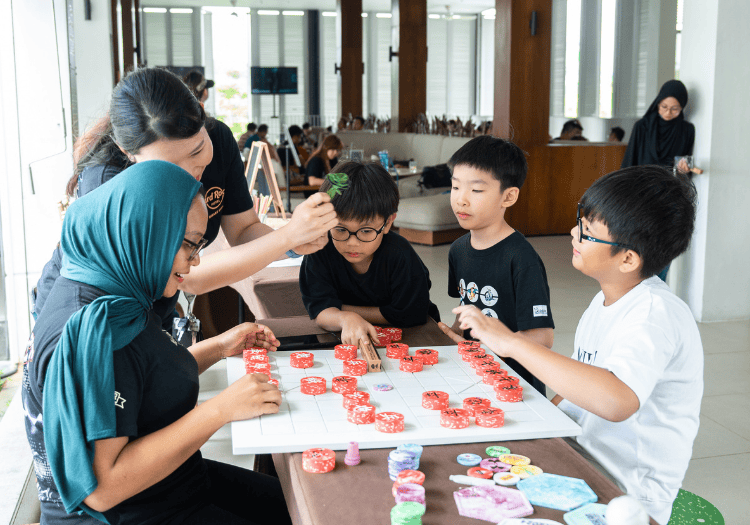 a group of people playing a board game