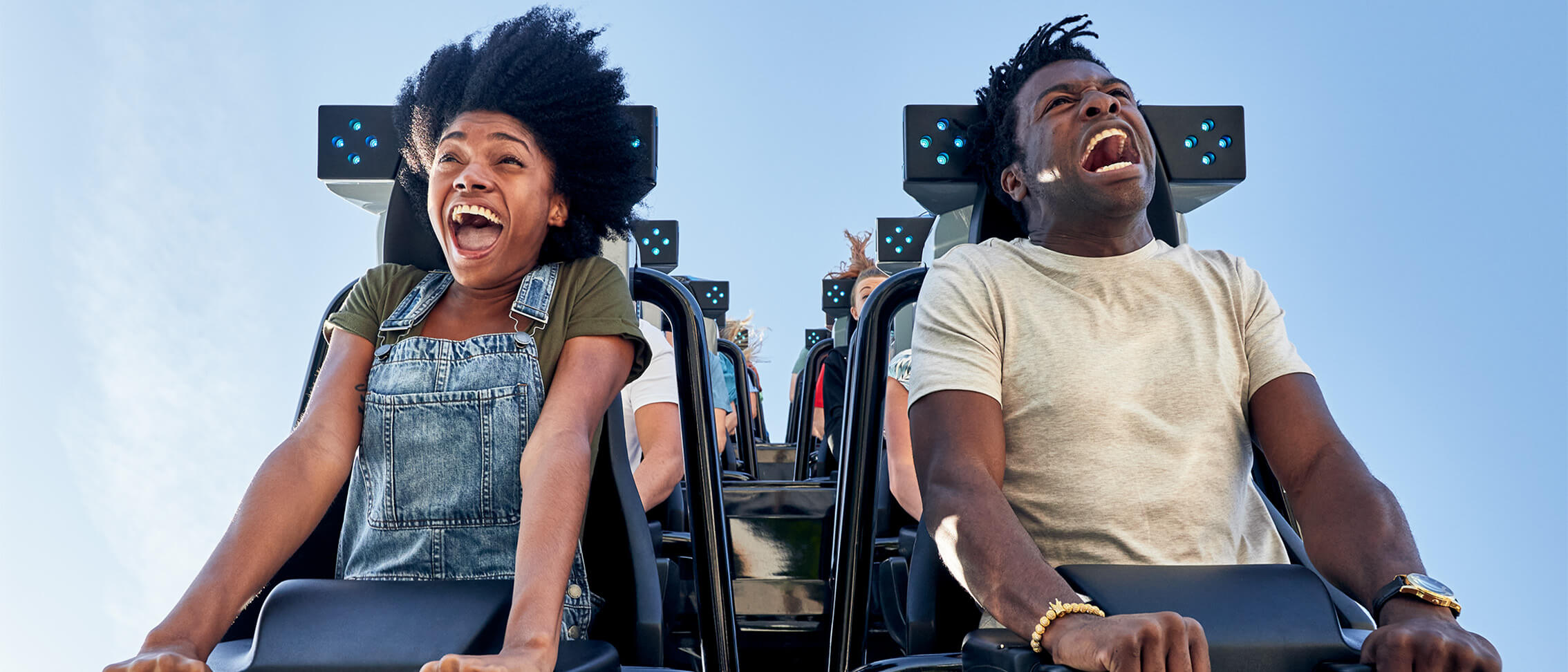 a group of people laughing on a roller coaster