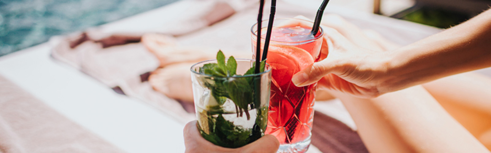 a pair of hands holding drinks